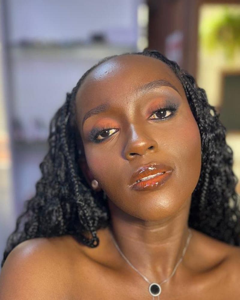 Bronze glam makeup with glossy lip